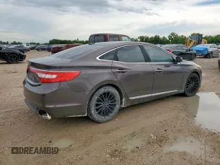 2015 Hyundai Azera Limited z VIN KMHFH4JG7FA483586, wystawiony jako Copart lot #61013125 z przebiegiem 127 766 mil mil oraz Czysty tytuł • Clean title. Historia ofert i sprzedaży dostępna na DreamBid. Obrazek 3.