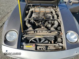 1984 Porsche 928 z VIN WP0JB0920ES860222, wystawiony jako Copart lot #44055645 z przebiegiem 166 689 mil mil oraz Nie do naprawy. Historia ofert i sprzedaży dostępna na DreamBid. Obrazek 11.