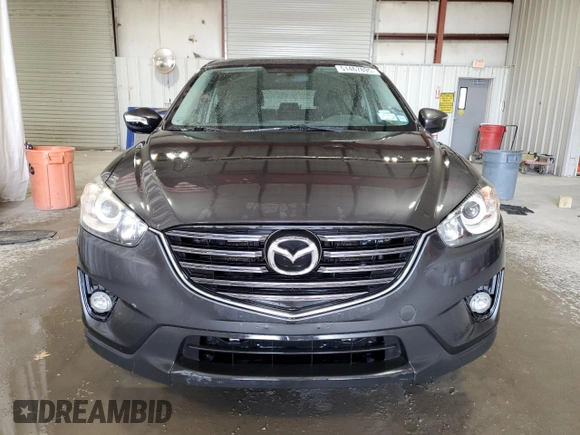 2016 Mazda CX-5 Touring with VIN JM3KE4CY3G0716346, listed as a Copart auction lot 51467895 with 133,218 mi miles and Salvage Title. Bid and sale history available at carsss.com. Image 5.