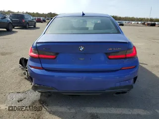 2020 BMW 3 Series M340i xDrive with VIN WBA5U9C00LFH68766, listed as a Copart auction lot 49077125 with 56,730 mi miles and Salvage Title. Bid and sale history available at DreamBid. Image 6.