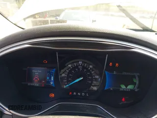 2015 Ford Fusion SE Hybrid z VIN 3FA6P0LU3FR163695, wystawiony jako IAAI lot #42428393 z przebiegiem 237 835 mil mil oraz . Historia ofert i sprzedaży dostępna na DreamBid. Obrazek 7.