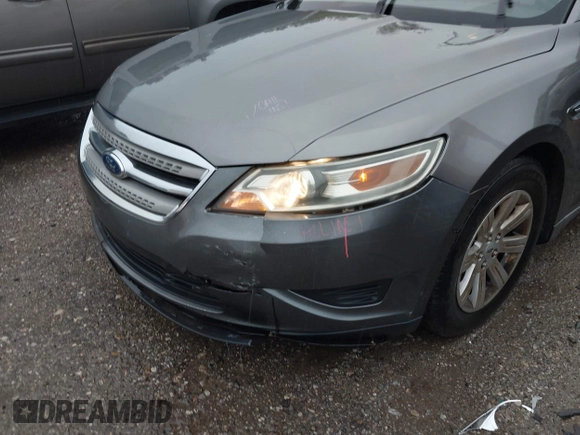 2011 Ford Taurus SE with VIN 1FAHP2DW2BG181059, listed as a IAAI auction lot 42036867 with 103,394 mi miles. Bid and sale history available at carsss.com. Image 6.