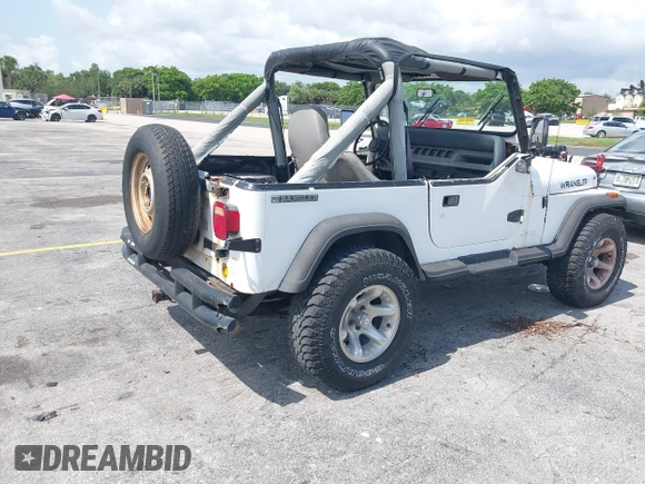 1990 Jeep Wrangler with VIN 2J4FY29T7LJ528844, listed as a IAAI auction lot 42354175 with 69,349 mi miles and . Bid and sale history available at DreamBid. Image 4.