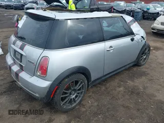 2006 MINI Hardtop S with VIN WMWRE33546TL23876, listed as a IAAI auction lot 41858060 with 146,359 mi miles and . Bid and sale history available at DreamBid. Image 4.