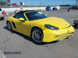 2021 Porsche 718 Boxster z VIN WP0CA2A8XMS210397, wystawiony jako IAAI lot #42271755 z przebiegiem 43 518 mil mil oraz . Historia ofert i sprzedaży dostępna na DreamBid. Obrazek 1.