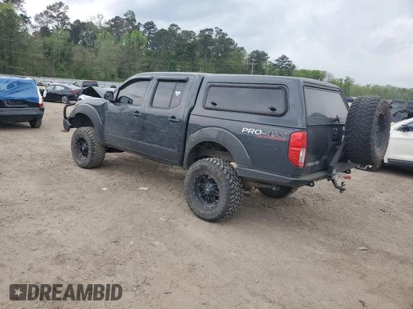 2012 Nissan Frontier Pro-4X with VIN 1N6AD0EVXCC415470, listed as a Copart auction lot 50650915 with 157,160 mi miles and Salvage title. Bid and sale history available at DreamBid. Image 2.