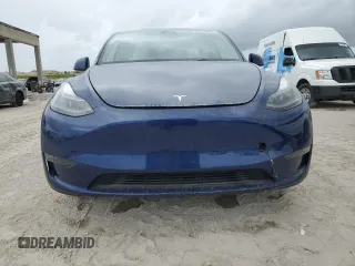 2023 Tesla Model Y Long Range z VIN 7SAYGDEE5PF787794, wystawiony jako Copart lot #55212605 z przebiegiem 30 277 mil mil oraz Szkoda całkowita • Salvage title. Historia ofert i sprzedaży dostępna na DreamBid. Obrazek 5.