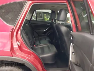 2016 Mazda CX-5 Grand Touring with VIN JM3KE4DY7G0731057, listed as a IAAI auction lot 41118072 with 134,107 mi miles and . Bid and sale history available at carsss.com. Image 8.