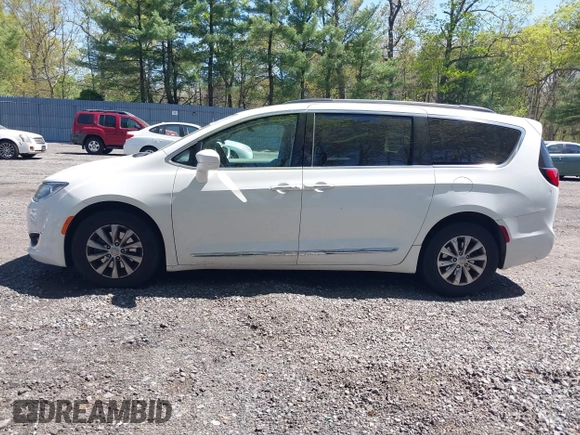 2017 Chrysler Pacifica Touring L with VIN 2C4RC1BG0HR821230, listed as a IAAI auction lot 42158120 with 98,354 mi miles and . Bid and sale history available at DreamBid. Image 14.