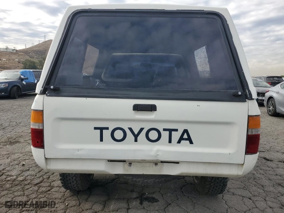1989 Toyota 4WD Pickups DLX with VIN JT4RN01P5K0000258, listed as a Copart auction lot 84696154 with 153785 miles and Clean Title. Bid and sale history available at carsss.com. Image 6.