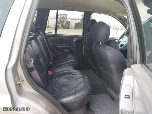 1999 Jeep Grand Cherokee Laredo with VIN 1J4GW58S6XC613307, listed as a IAAI auction lot 41592687 with 264,176 mi miles. Bid and sale history available at carsss.com. Image 8.