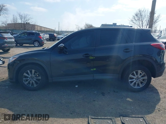 2016 Mazda CX-5 Sport with VIN JM3KE4BY3G0843177, listed as a IAAI auction lot 41804094 with 193,461 mi miles. Bid and sale history available at carsss.com. Image 14.