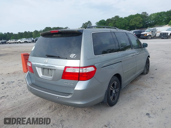 2005 Honda Odyssey TOURING with VIN 5FNRL38815B027811, listed as a IAAI auction lot 42105642 with 303,913 mi miles. Bid and sale history available at carsss.com. Image 4.