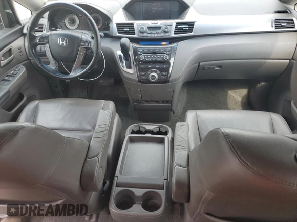 2012 Honda Odyssey Touring with VIN 5FNRL5H94CB102177, listed as a Copart auction lot 55942185 with 179,418 mi miles and Salvage Title. Bid and sale history available at DreamBid. Image 8.