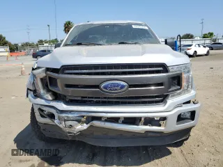 2018 Ford F-150 XL with VIN 1FTEW1CGXJFB40297, listed as a Copart auction lot 69642404 with 92,561 mi miles and Salvage title. Bid and sale history available at DreamBid. Image 5.