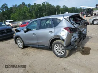2015 Mazda CX-5 Touring with VIN JM3KE2CY7F0435914, listed as a Copart auction lot 61885704 with 0 mi miles and Salvage Title. Bid and sale history available at carsss.com. Image 2.