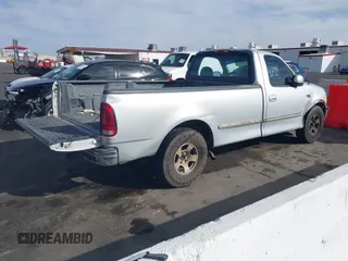 1997 Ford F-150 with VIN 1FTEF17W3VLA19510, listed as a IAAI auction lot 41711010 with 214,984 mi miles and . Bid and sale history available at DreamBid. Image 4.