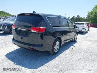 2023 Chrysler Voyager LX with VIN 2C4RC1CGXPR602904, listed as a IAAI auction lot 42059500 with 42,636 mi miles. Bid and sale history available at carsss.com. Image 4.