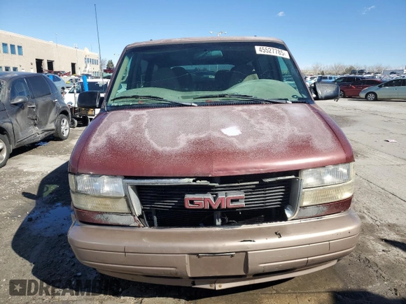 1999 GMC Safari z VIN 1GKEL19W2XB506085, wystawiony jako Copart lot #45527785 z przebiegiem 213 594 mil mil oraz Szkoda całkowita • Salvage title. Historia ofert i sprzedaży dostępna na DreamBid. Obrazek 5.