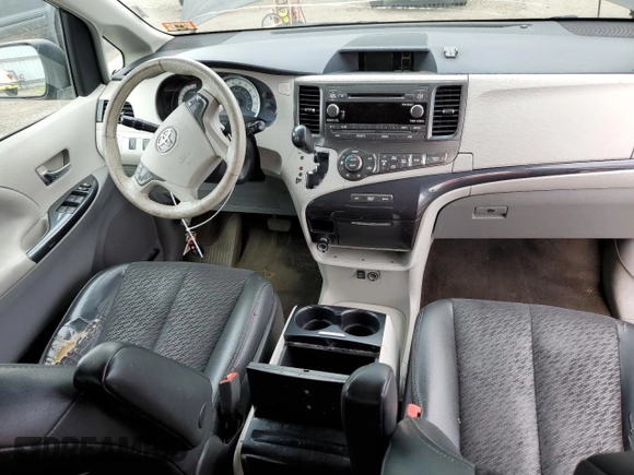 2014 Toyota Sienna SE with VIN 5TDXK3DC7ES425945, listed as a Copart auction lot 63067955 with 173,815 mi miles and Salvage title. Bid and sale history available at DreamBid. Image 8.