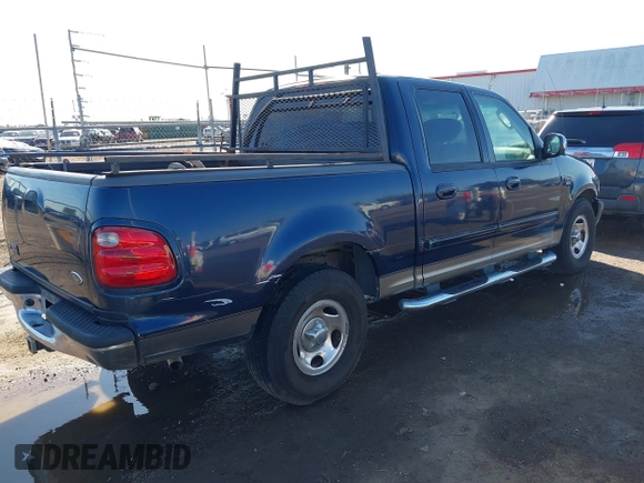 2002 Ford F-150 XLT with VIN 1FTRW07692KC25069, listed as a IAAI auction lot 41387047 with 208,811 mi miles. Bid and sale history available at carsss.com. Image 4.