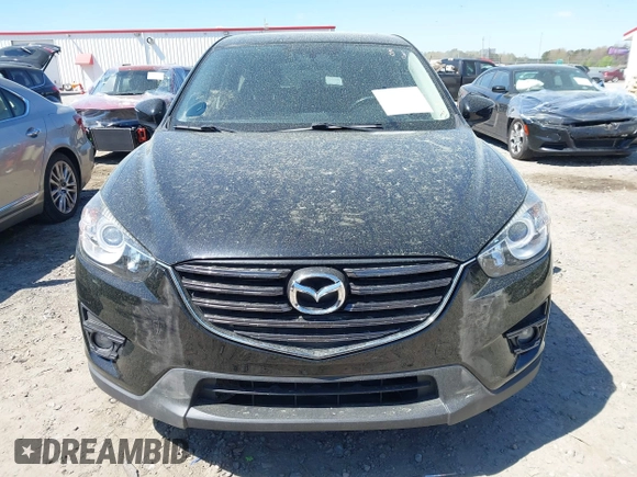 2016 Mazda CX-5 Grand Touring with VIN JM3KE4DY9G0893174, listed as a IAAI auction lot 41887814 with 79,811 mi miles. Bid and sale history available at carsss.com. Image 11.