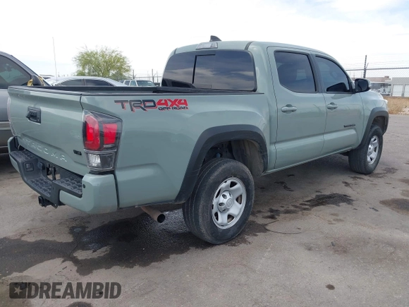 2022 Toyota Tacoma SR with VIN 3TMCZ5AN0NM507320, listed as a IAAI auction lot 42220296 with 33,342 mi miles and . Bid and sale history available at DreamBid. Image 4.