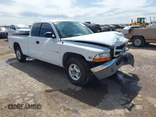 1999 Dodge Dakota SLT with VIN 1B7GL22X6XS186007, listed as a IAAI auction lot 41953254 with 322,541 mi miles. Bid and sale history available at carsss.com. Image 1.