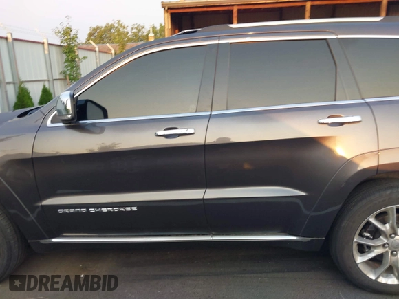 2015 Jeep Grand Cherokee Summit with VIN 1C4RJFJT3FC748507, listed as a IAAI auction lot 40271829 with 86,859 mi miles. Bid and sale history available at carsss.com. Image 14.