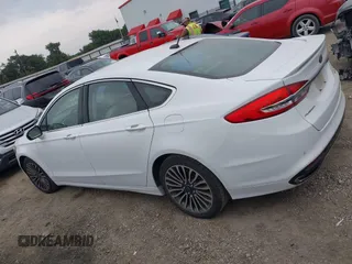 2017 Ford Fusion Titanium z VIN 3FA6P0K96HR124146, wystawiony jako IAAI lot #42428041 z przebiegiem 204 306 mil mil oraz . Historia ofert i sprzedaży dostępna na DreamBid. Obrazek 14.