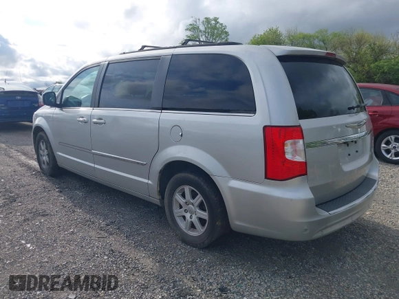 2011 Chrysler Town & Country Touring with VIN 2A4RR5DG4BR682109, listed as a IAAI auction lot 42189832 with 208,709 mi miles and . Bid and sale history available at DreamBid. Image 3.