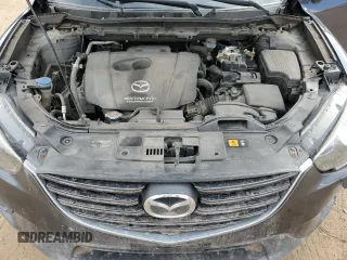 2016 Mazda CX-5 Grand Touring z VIN JM3KE4DY0G0633861, wystawiony jako Copart lot #47748645 z przebiegiem 112 219 mil mil oraz Szkoda całkowita • Salvage title. Historia ofert i sprzedaży dostępna na DreamBid. Obrazek 14.