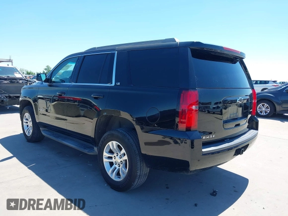 2015 Chevrolet Tahoe LS with VIN 1GNSCAKC5FR645736, listed as a IAAI auction lot 42064623 with 223,149 mi miles and . Bid and sale history available at DreamBid. Image 3.