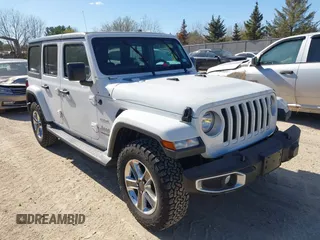 2019 Jeep Wrangler Unlimited Sahara with VIN 1C4HJXEN3KW591602, listed as a IAAI auction lot 42148117 with 73,763 mi miles and . Bid and sale history available at DreamBid. Image 1.