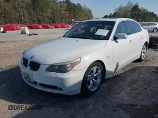 2007 BMW 5 Series 525i with VIN WBANE53527CW62776, listed as a IAAI auction lot 41870614 with 180,886 mi miles and . Bid and sale history available at carsss.com. Image 2.