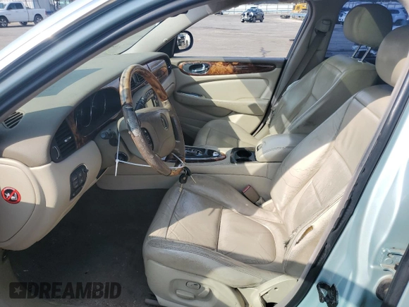 2004 Jaguar XJ with VIN SAJWA71C94SG24466, listed as a Copart auction lot 46610995 with 173,570 mi miles and Salvage Title. Bid and sale history available at carsss.com. Image 7.