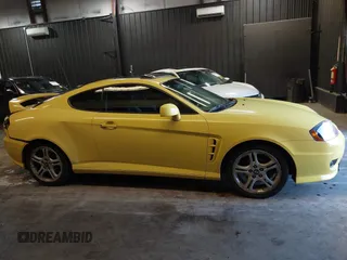 2006 Hyundai Tiburon GT z VIN KMHHN65F56U225936, wystawiony jako IAAI lot #41695280 z przebiegiem 121 110 mil mil oraz . Historia ofert i sprzedaży dostępna na DreamBid. Obrazek 13.