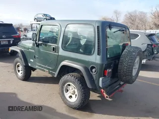 1998 Jeep Wrangler SE with VIN 1J4FY29P1WP760687, listed as a IAAI auction lot 41720889 with 210,592 mi miles. Bid and sale history available at carsss.com. Image 3.