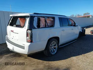 2019 GMC Yukon XL SLT with VIN 1GKS1GKC1KR335082, listed as a IAAI auction lot 41652504 with 135,824 mi miles. Bid and sale history available at carsss.com. Image 4.