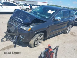 2015 Jeep Grand Cherokee High Altitude with VIN 1C4RJFCG5FC807394, listed as a IAAI auction lot 42452034 with 72,011 mi miles and . Bid and sale history available at DreamBid. Image 2.