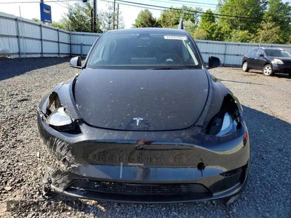 2023 Tesla Model Y Long Range z VIN 7SAYGDEE1PF865195, wystawiony jako Copart lot #57455765 z przebiegiem 32 011 mil mil oraz Szkoda całkowita • Salvage title. Historia ofert i sprzedaży dostępna na DreamBid. Obrazek 5.