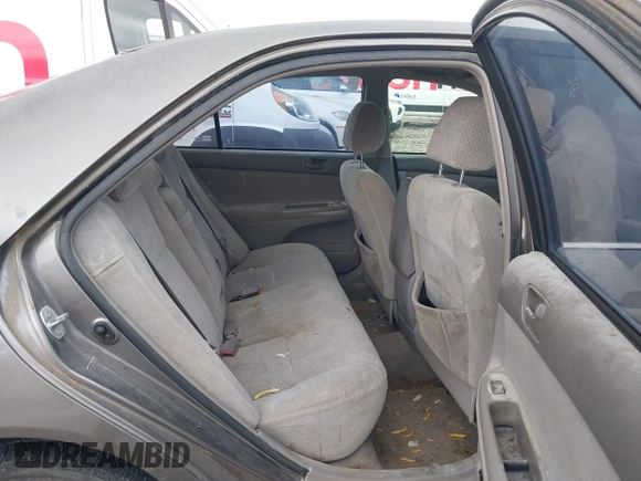 2004 Toyota Camry LE with VIN 4T1BE32K64U868802, listed as a IAAI auction lot 42141061 with 254,215 mi miles. Bid and sale history available at carsss.com. Image 8.