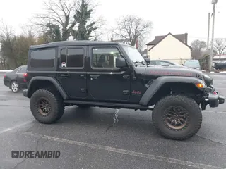 2022 Jeep Wrangler Unlimited Rubicon with VIN 1C4HJXFGXNW127064, listed as a IAAI auction lot 41491203 with 47,700 mi miles and . Bid and sale history available at DreamBid. Image 6.