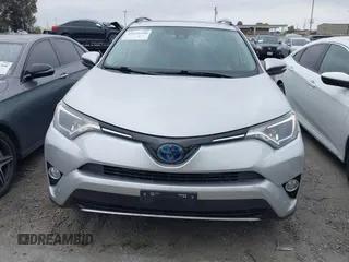 2016 Toyota RAV4 Hybrid XLE with VIN JTMRJREVXGD029019, listed as a IAAI auction lot 42021530 with 74,400 mi miles. Bid and sale history available at carsss.com. Image 13.