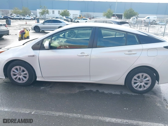 2019 Toyota Prius L Eco with VIN JTDKARFU7K3093038, listed as a IAAI auction lot 41768066 with 124,495 mi miles. Bid and sale history available at carsss.com. Image 14.
