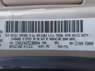 2014 Jeep Grand Cherokee Laredo with VIN 1C4RJFAG7EC380544, listed as a IAAI auction lot 42021130 with 166,589 mi miles. Bid and sale history available at carsss.com. Image 9.