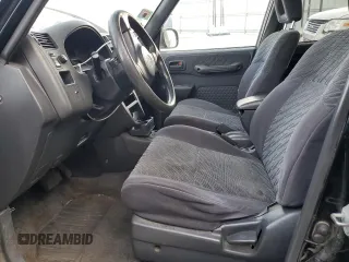 1999 Toyota RAV4 with VIN JT3GP10V9X7042801, listed as a Copart auction lot 82712874 with 256,151 mi miles and Salvage Title. Bid and sale history available at DreamBid. Image 7.