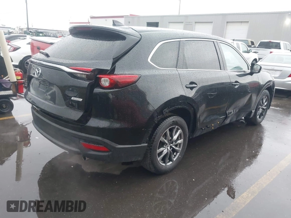 2016 Mazda CX-9 Touring with VIN JM3TCBCY5G0101490, listed as a IAAI auction lot 42062846 with 85,352 mi miles and . Bid and sale history available at DreamBid. Image 4.