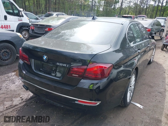 2016 BMW 5 Series 528i xDrive with VIN WBA5A7C57GG643446, listed as a IAAI auction lot 42039384 with 132,119 mi miles. Bid and sale history available at carsss.com. Image 4.