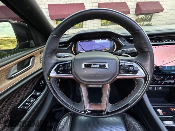 2023 Jeep Grand Cherokee Summit with VIN 1C4RJHEG2P8882566, listed as a Copart auction lot 65095905 with 59,970 mi miles and Salvage title. Bid and sale history available at DreamBid. Image 11.